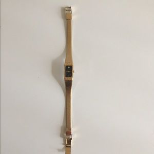 Gold and black bulova watch